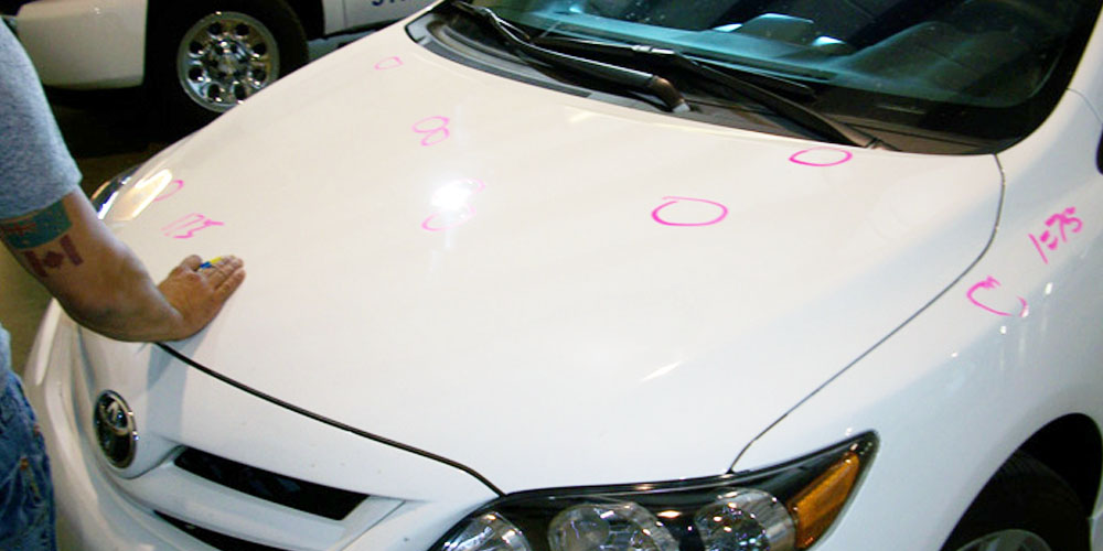 Image Of Car's Body Being Painted Black